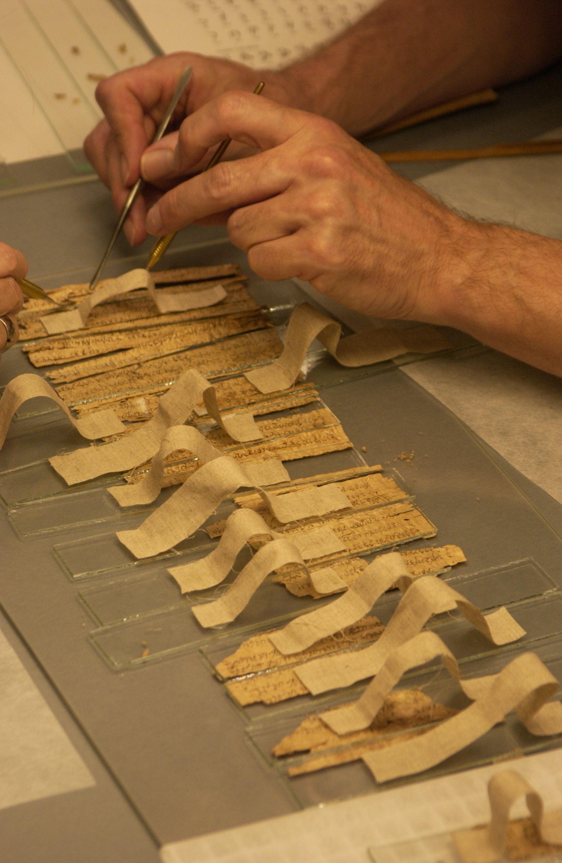 Krueger and Barnard held each fragment in place with a glass weight, complete with a cloth handle so each could be easily removed.